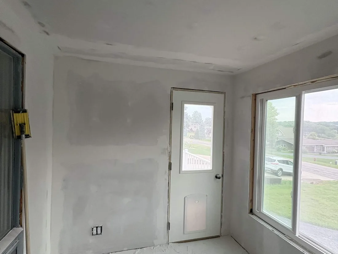The same four seasons room with the drywall taped, finished and ready for paint