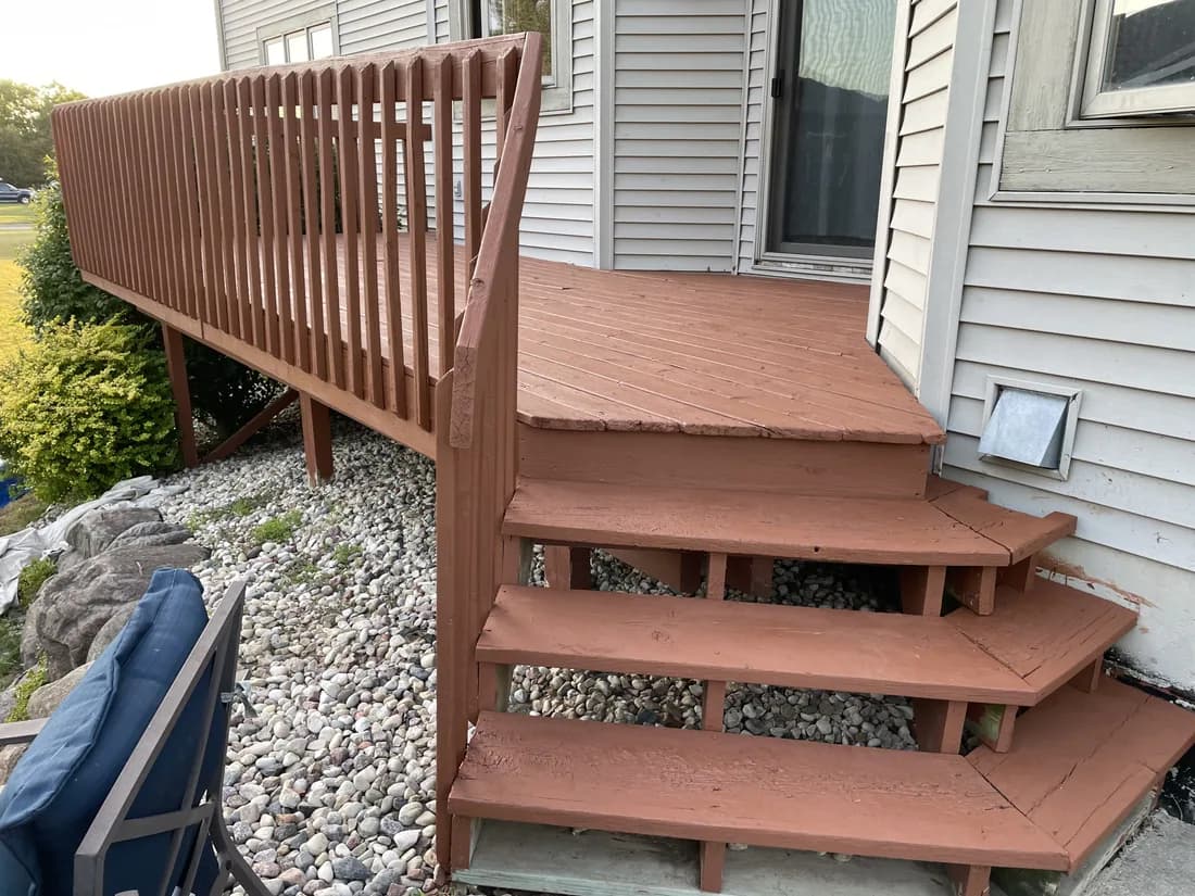 Freshly stained deck with even color and crisp step lines