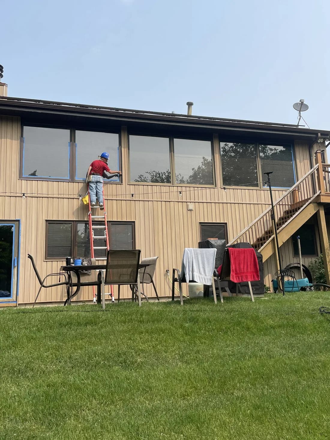 On the job — careful brushwork on second-story trim